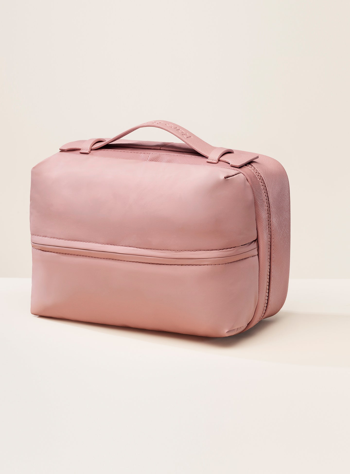 pdp puffy toiletry bag mauve handle.jpg pdp puffy toiletry bag mauve handle.jpg